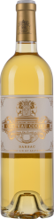 Goldgelber Wein in eleganter Flasche mit verziertem Etikett.