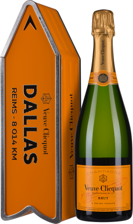 Champagnerflasche mit elegantem goldenen Etikett und passender, orangefarbener Geschenkschachtel.