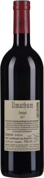 Dunkle Weinflasche mit rotem Kapselverschluss und cremefarbenem Etikett.