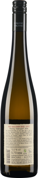 Schlanke Weinfalsche mit dunklem Glas und schwarzem Schraubverschluss, Etikett detailliert beschrieben.