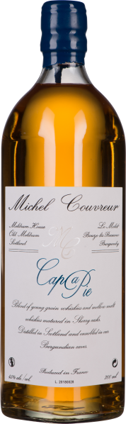 Braune Flüssigkeit in klarer Flasche mit blauem Wachsverschluss und elegantem Etikett.