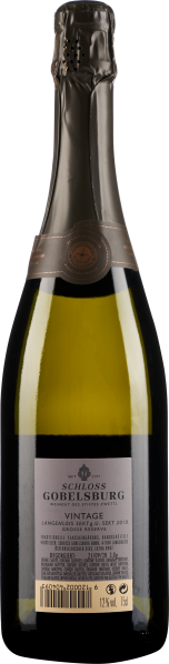 Flasche Sekt mit goldener Folie, grünem Glas und gestempeltem Etikett.