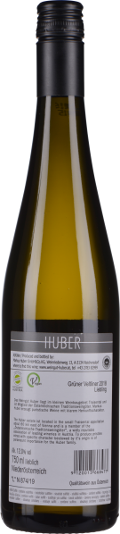 Grünlich-gelbe Weinflasche mit schwarzem Schraubverschluss, Rücketikett zeigt Details.