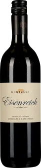 Eine schlanke Weinflasche mit dunkelroter Flüssigkeit, schwarzem Schraubverschluss und einem cremefarbenen Etikett mit eleganter Schrift.