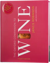 Ein Buch mit einem roten Cover, auf dem ein großer, weißer Titel "Wine" hervorsticht. Eine sichtbare Weinkorken-Grafik ist in die Mitte integriert. Der Hintergrund ist einfarbig und dekorativ gestaltet.