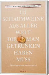 Buchcover mit beigem Hintergrund und weißen, erhabenen Schriftzügen, die eine Liste von Schaumweinen ankündigen. Zentral befindet sich ein Korken mit Agraffe als dekoratives Element.