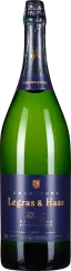 Grüne Champagnerflasche mit dunkelblau-goldenem Etikett und Verschluss.