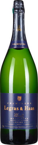 Grüne Champagnerflasche mit dunkelblauem Etikett und goldenen Akzenten.