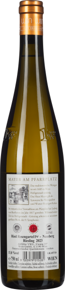 Klare Glasflasche mit kupferfarbenem Verschluss und detailliertem Etikett.