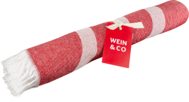 Gerolltes, rot-weiß gestreiftes textiles Produkt mit Fransen und rotem Etikett.