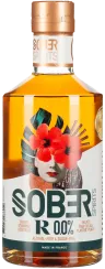 Klarglasflasche mit Kupferverschluss, floralem Etikett und Gesichtsgrafik in Rot und Grün.