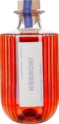 Geriffelte Flasche mit leuchtend rotem Inhalt und Korkenverschluss.