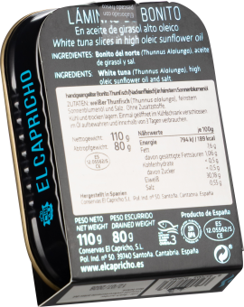 Schwarze Dose mit blauer Schrift und weißen Etiketten, Produktinformationen gut sichtbar.