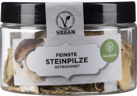 Rundes Glas mit schwarzem Deckel, gefüllt mit getrockneten Pilzen.