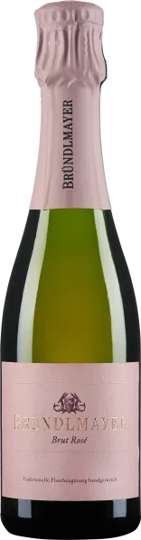 Die Flasche zeigt einen Schaumwein mit einem blassrosa Etikett und einer passenden metallischen Folie am Hals. Die Form ist elegant und klassisch, passend für einen hochwertigen Sekt oder Champagner.