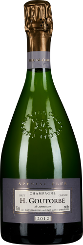 Grüne Champagnerflasche mit goldener Folie und geprägtem Etikett.