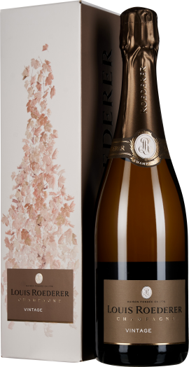 Flasche Champagner mit goldener Folie auf dem Korken und elegantem Etikett. Die Verpackung zeigt ein zartes Blumenmotiv in sanften Rosa- und Beigetönen.