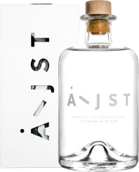 Klar gestaltete Glasflasche mit breitem Holzverschluss; minimalistisches Design auf einer weißen Schachtel mit moderner Typografie.