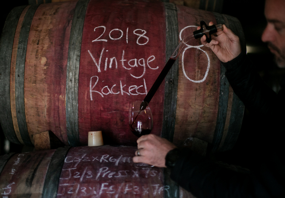 Thelema Winemaker Duncan Clarke Doing tastigs out of barrels.